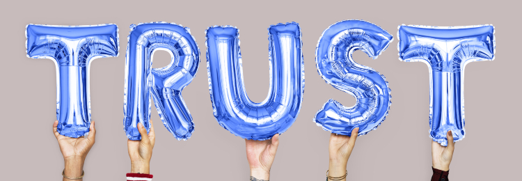 Purple letter ballons spelling the word trust
