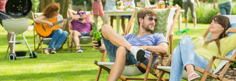 Employees wearing casual outfits at a company picnic. How you should dress for a company event.