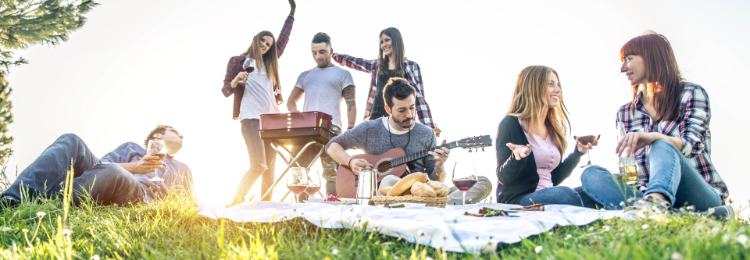 Employees enjoying an outdoor picnic. Things to consider when planning an employee appreciation picnic.